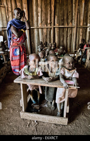 Children and teacher in a Massai village school, Kenya, Africa Stock Photo