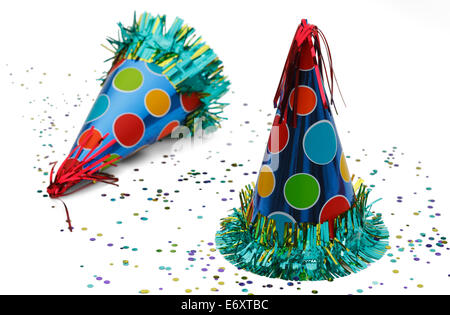 Two Celebration Hats with Confetti Isolated on White Background. Stock Photo