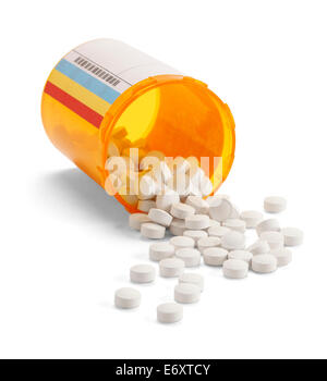 Prescription pill bottle spilling pills on to surface isolated on a white background. Stock Photo