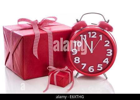 Christmas: big red gift box with red alarm clock - last minute christmas shopping Stock Photo