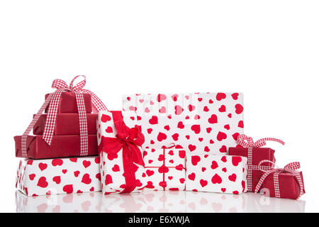 Christmas, mother's or valentine's day: red and white gift boxes with bow and ribbons, isolated with hearts Stock Photo