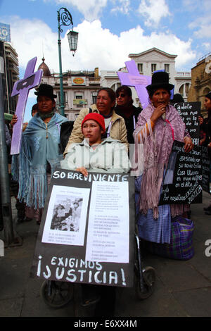 La Paz, Bolivia, 1st September 2014. Carla Miosiris Osuna, a  victim of domestic violence during a protest rally against violence against women and to repudiate recent statements made by several candidates during the current election campaign that appear to minimise the problem and discriminate against women. According to a WHO report in January 2013 Bolivia is the country with the highest rate of violence against women in Latin America, there have been 453 cases of femicide since 2006 during the current government. Credit:  James Brunker/Alamy Live News
