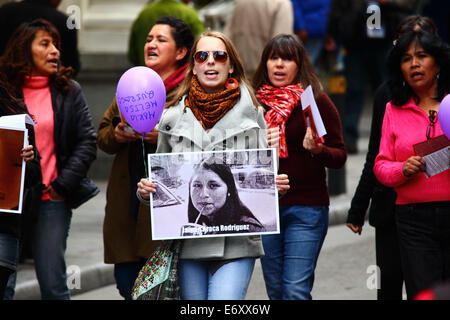 La Paz, Bolivia, 1st September 2014. Womens Rights Activists and supporters march to protest against machismo and violence against women, and to repudiate recent statements made by several candidates during the current election campaign that appear to minimise the problem and discriminate against women. According to a WHO report in January 2013 Bolivia is the country with the highest rate of violence against women in Latin America, there have been 453 cases of femicide since 2006 during the current government. Credit:  James Brunker/Alamy Live News