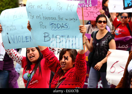 La Paz, Bolivia, 1st September 2014. Womens Rights Activists and supporters march to protest against machismo and violence against women, and to repudiate recent statements made by several candidates during the current election campaign that appear to minimise the problem and discriminate against women. According to a WHO report in January 2013 Bolivia is the country with the highest rate of violence against women in Latin America, there have been 453 cases of femicide since 2006 during the current government. Credit:  James Brunker/Alamy Live News