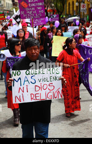 La Paz, Bolivia, 1st September 2014. Womens Rights Activists and supporters march to protest against machismo and violence against women, and to repudiate recent statements made by several candidates during the current election campaign that appear to minimise the problem and discriminate against women. According to a WHO report in January 2013 Bolivia is the country with the highest rate of violence against women in Latin America, there have been 453 cases of femicide since 2006 during the current government. Credit:  James Brunker/Alamy Live News