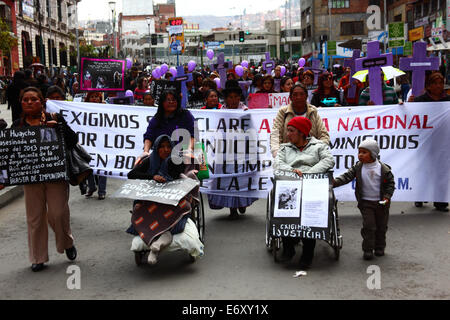La Paz, Bolivia, 1st September 2014. Womens Rights Activists and victims of violence against women during a protest march to repudiate recent statements made by several candidates during the current election campaign that appear to minimise the problem and discriminate against women. According to a WHO report in January 2013 Bolivia is the country with the highest rate of violence against women in Latin America, there have been 453 cases of femicide since 2006 during the current government. Credit:  James Brunker/Alamy Live News