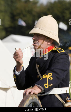 Officer in the Uniform of the Royal Artillery in Zululand smoking a pipe Stock Photo