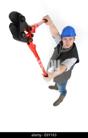 Man using bolt-cutters Stock Photo