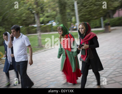 Tehran, Iran. 1st Sep, 2014. Iranians walk in Tehran's Artists Park. Credit:  Morteza Nikoubazl/ZUMA Wire/Alamy Live News Stock Photo