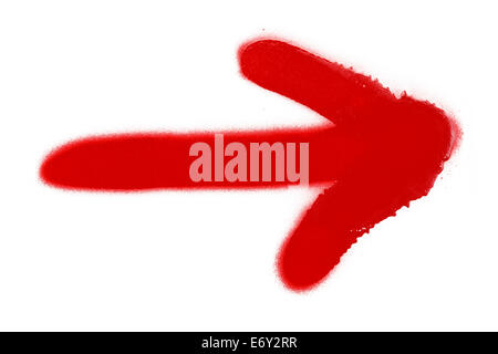 Red Spray Paint Arrow Isolated on White Background. Stock Photo