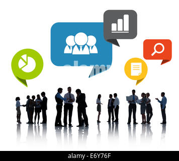 Silhouettes of Business People Discussing Social Networking Stock Photo