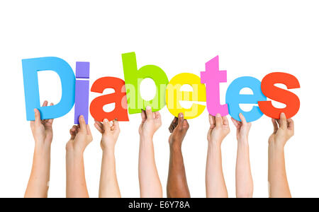 Multi-Ethnic Group Of Diverse People Holding Letters That Form Diabetes Stock Photo