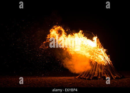 Blazing bonfire on the beach of a small island in the Philippines Stock Photo