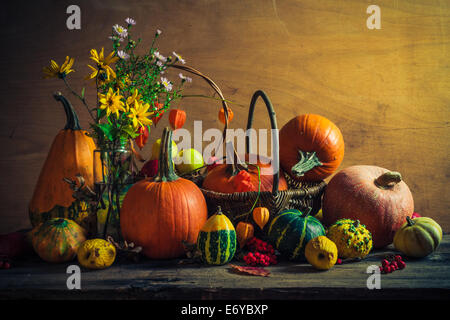 Autumnal Halloween still life with pumpkins, rowan and quinces Stock Photo