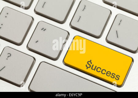 Close Up of Gold Success Key Button on a Keyboard. Stock Photo