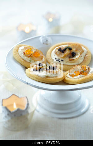 Blinis with scallops and fish roe Stock Photo