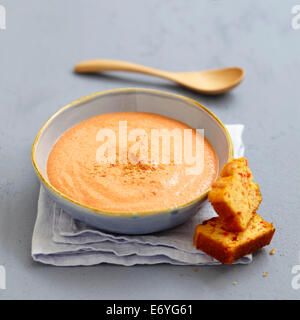 Cream of red pepper soup with sweet corn bread Stock Photo