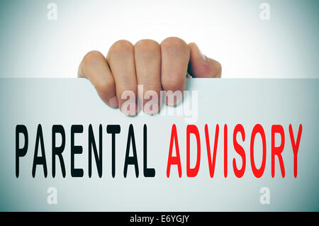 man hand holding a signboard with the text parental advisory written in it Stock Photo