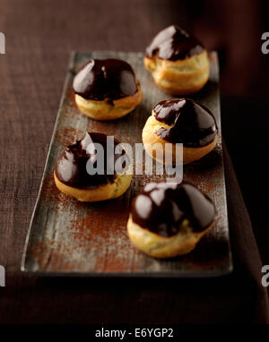 Puff pastries coated in dark chocolate Stock Photo