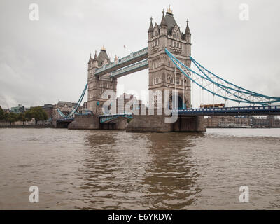 tower bridge london viewed from teh thames on an overcast day under grey sky. Stock Photo