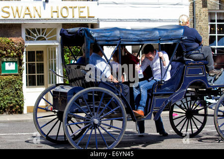 Tourist carriage outside the Swan Hotel, Southwold, Suffolk, UK Stock Photo