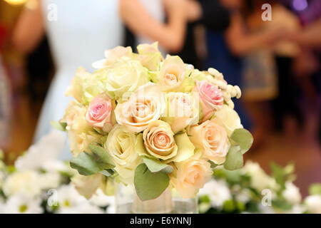 Dancing couples during wedding celebration against the background of flowers Stock Photo