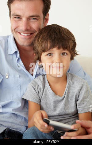 Father and son with cellphone Stock Photo