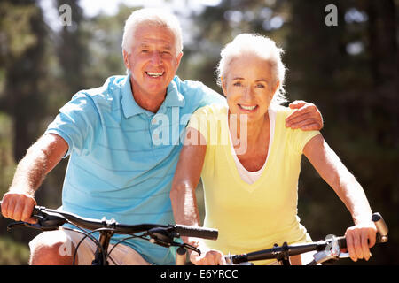 Senior couple on bicycles Stock Photo