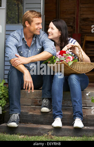 Couple sitting  on veranda Stock Photo