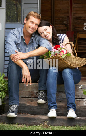 Couple sitting  on veranda Stock Photo