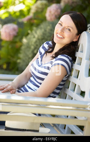 portrait of a woman relaxing in the garden siam tulip Stock Photo - Alamy