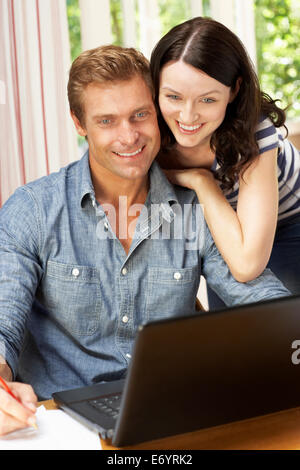 Couple Working In Home Office Stock Photo