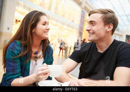 Young Couple Meeting On Date In Café Stock Photo