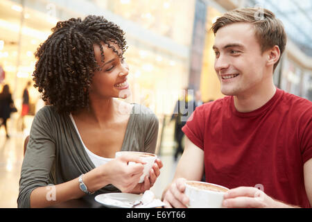 Young Couple Meeting On Date In Café Stock Photo
