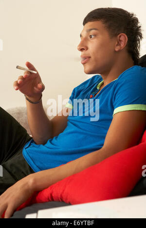 Teenage boy smoking Stock Photo