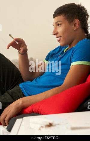 Teenage boy smoking Stock Photo