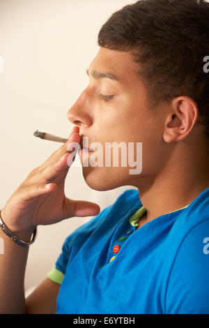 Teenage boy smoking Stock Photo