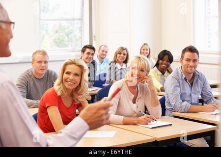 Senior tutor teaching class Stock Photo
