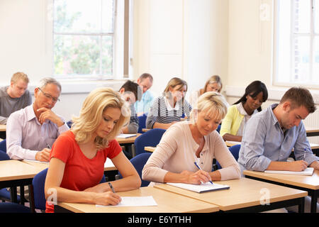 Mixed group of students in class Stock Photo