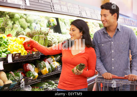 Couple shopping in supermarket Stock Photo