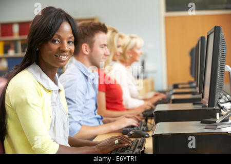 Students working on computers in library Stock Photo
