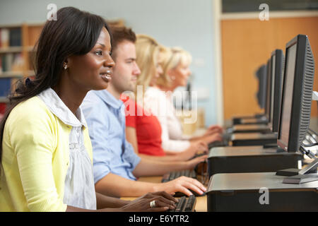 Students working on computers in library Stock Photo