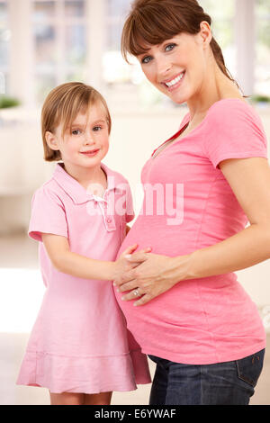 Pregnant woman with daughter Stock Photo