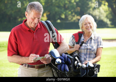 Senior couple on golf course Stock Photo