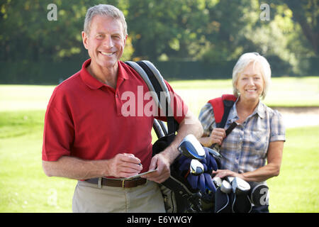 Senior couple on golf course Stock Photo