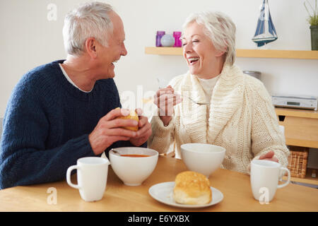 Senior Couple Having Bowl Of Soup For Lunch Stock Photo