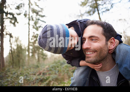 Young Man Relaxing On Roof Terrace With Cup Of Coffee Stock Photo
