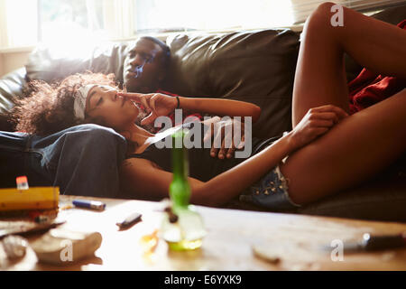 Couple Taking Drugs At Home Together Stock Photo