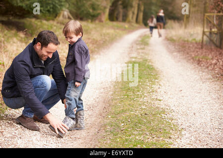 Couple Cycling Through Urban Park Together Stock Photo