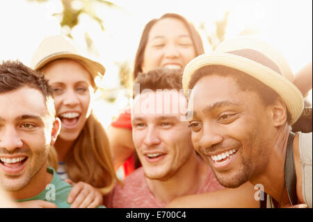 Group Of Friends Having Fun In Park Together Stock Photo
